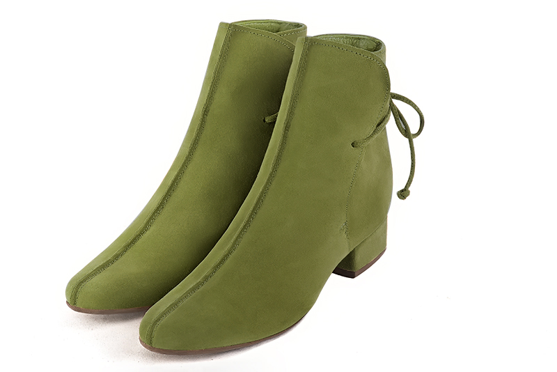 Pistachio green women's ankle boots with laces at the back. Round toe. Low block heels. Front view - Florence KOOIJMAN